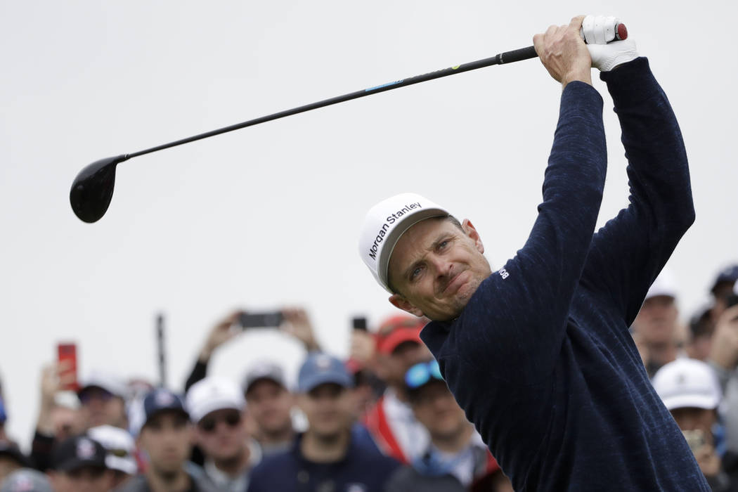 Justin Rose, of England, watches his tee shot on the ninth hole during the final round of the U ...