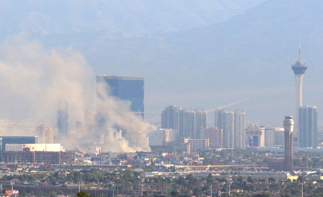 Heavy smoke is seen as Clark County and Las Vegas fire crews battle a blaze at The Park at 3900 ...