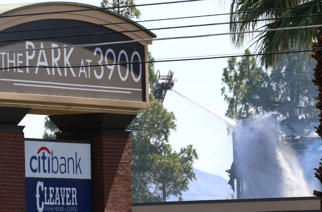 Crews battle a blaze at The Park at 3900 at 3900 Paradise Road, near East Twain Avenue, on Mond ...