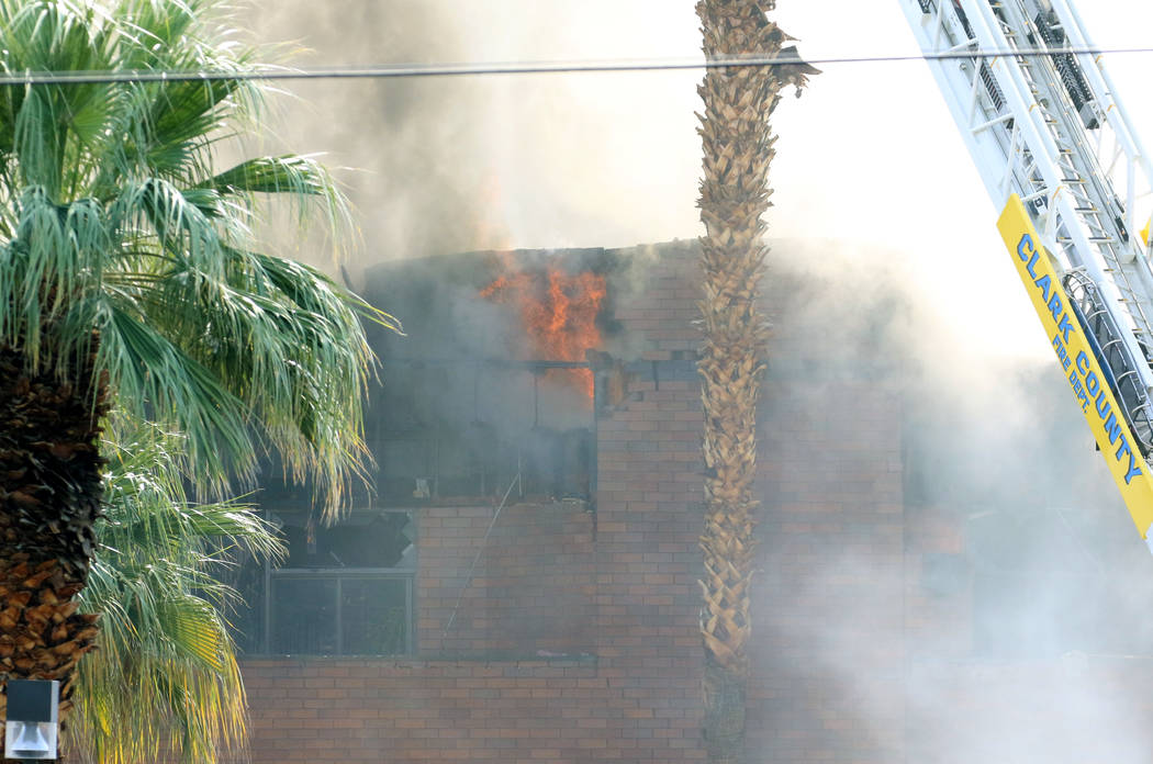 Crews battle a blaze at The Park at 3900 at 3900 Paradise Road, near East Twain Avenue, on Mond ...