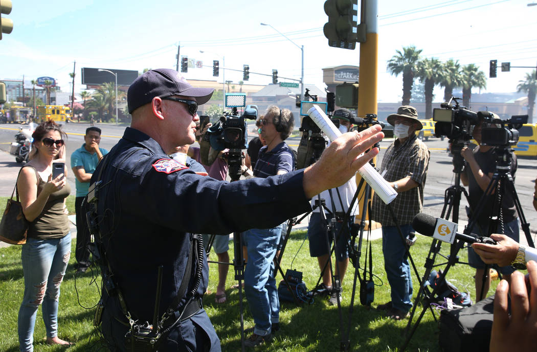 Clark County Fire Chief Greg Cassell, center, addresses the media during a press conference at ...