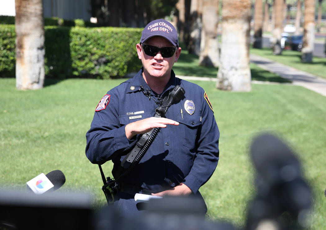 Clark County Fire Chief Greg Cassell, center, addresses the media during a press conference at ...