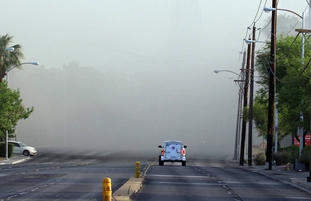 Smoke filled southbound Paradise Road was closed between East Flamingo Road and Twain as Clark ...