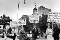 In a July 4, 1967, file photo Kay Tobin Lahusen, right, and other demonstrators carry signs cal ...