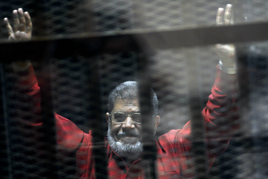 Former Egyptian President Mohammed Morsi, wearing a red jumpsuit that designates he has been se ...