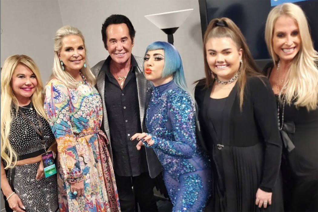 Lady Gaga greets Wayne Newton and his friends and family backstage at her 'Enigma' show at Park ...