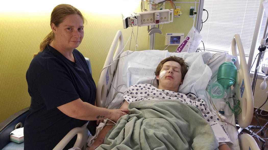 In this June 14, 2019 photo provided by The University of Kansas Health System, 15-year-old Eli ...