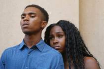 Dravon Ames, left, and Iesha Harper pause as they listen to a question during a news conference ...
