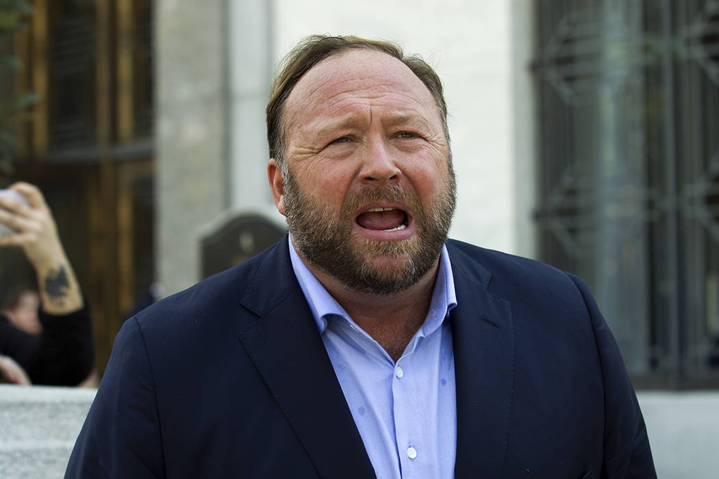 FILE--In this Sept. 5, 2018 file photo, Alex Jones speaks to reporters in Washington. Lawyers i ...