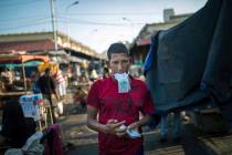 A flea market vendor counts his Bolivar bills in Maracaibo, Venezuela, May 16, 2019. Maracaibo ...