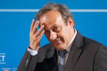 In a Feb.22, 2014, file photo, UEFA President Michel Platini arrives at a press conference in N ...