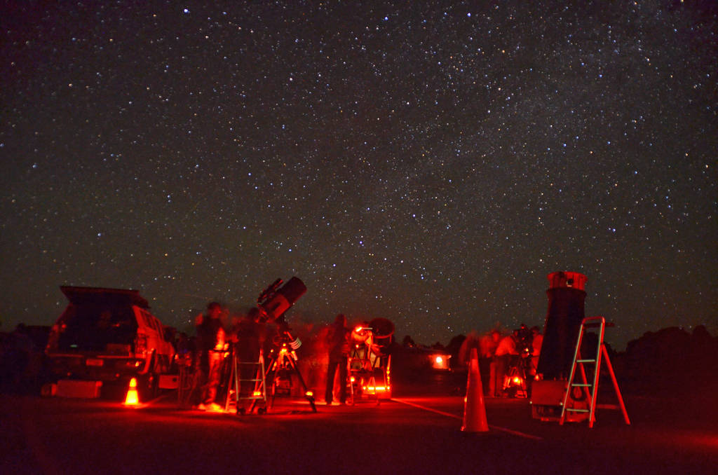 Red lights illuminate telescopes and stargazers during the annual Star Party at Grand Canyon Na ...