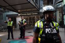Toronto Police secure the scene where shots were fired during the Toronto Raptors NBA basketbal ...