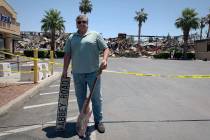 Richard Gacovino, 54, poses with two props from his television studio that he found on Tuesday, ...