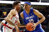 Kentucky forward PJ Washington (25) challenges Mississippi forward KJ Buffen (14) as he tries f ...