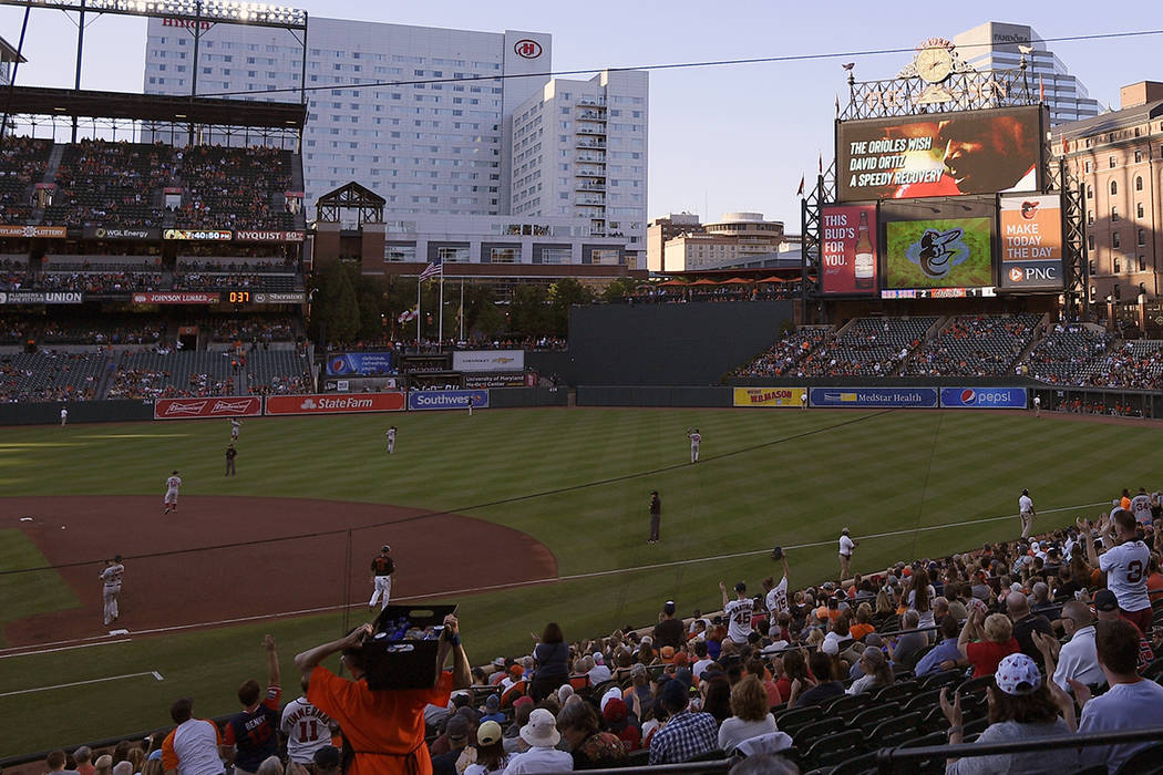 The center field scoreboard displays an image of Boston Red Sox great David Ortiz wishing him a ...