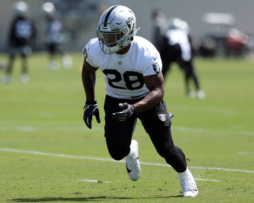 Oakland Raiders running back Josh Jacobs (28) runs a route during an offseason training session ...