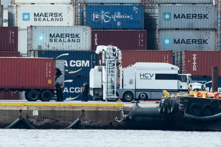 Authorities search a container along the Delaware River in Philadelphia, Tuesday, June 18, 2019 ...