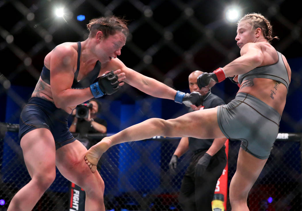 Hannah Goldy lands a kick to Kali Robbins in the third round of their strawweight bout on the o ...