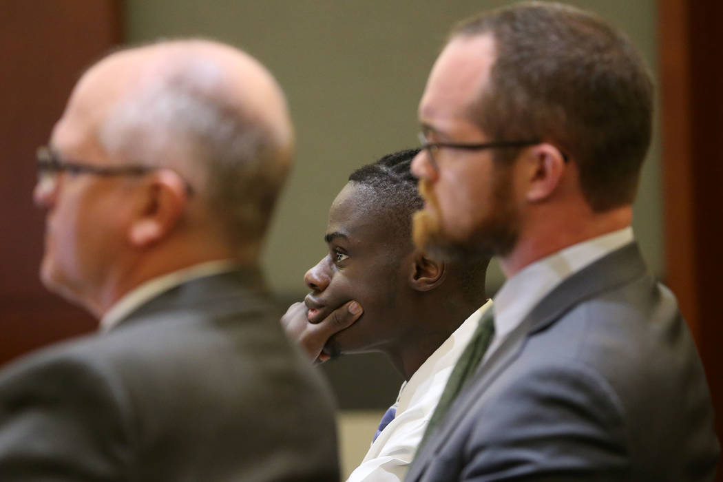 Weslie Martin, center, accused of burglarizing Wayne Newton's home, listens during his court he ...
