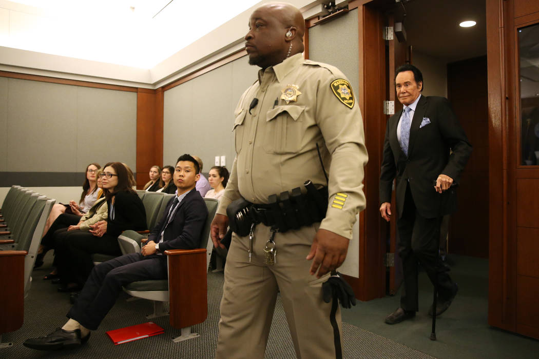 Wayne Newton enters the courtroom to testify as a witness in the State of Nevada case against W ...