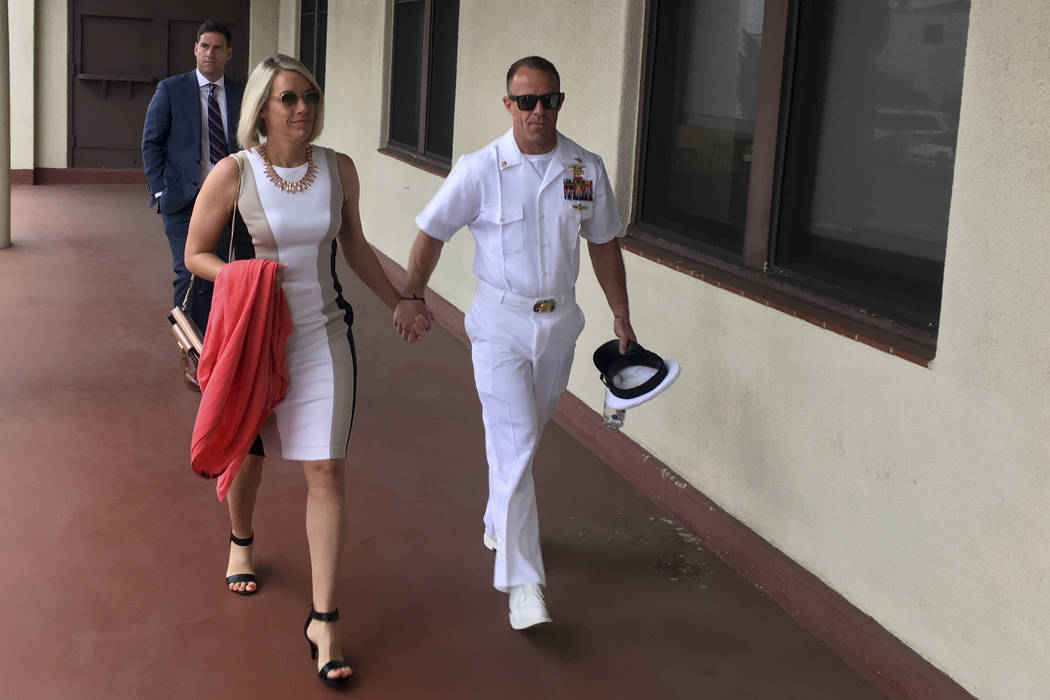 Navy Special Operations Chief Edward Gallagher, right, walks with his wife, Andrea Gallagher as ...