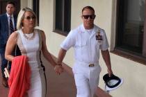Navy Special Operations Chief Edward Gallagher, right, walks with his wife, Andrea Gallagher as ...
