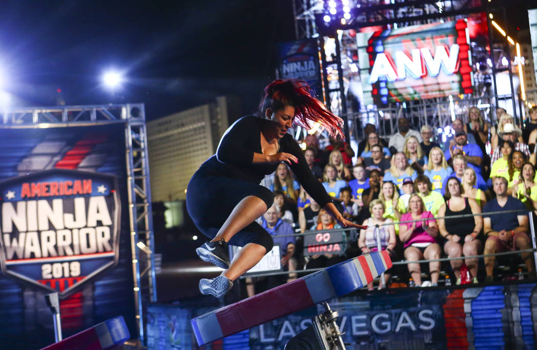 Nancy Danae of Hot 97.5 braces for impact while attempting the first obstacle from stage one du ...