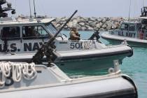U.S. Navy patrol boats carrying journalists to see damaged oil tankers leaves a U.S. Navy 5th F ...