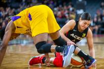 Los Angeles Sparks guard Alexis Jones, left, loses the ball to Las Vegas Aces guard Kelsey Plum ...