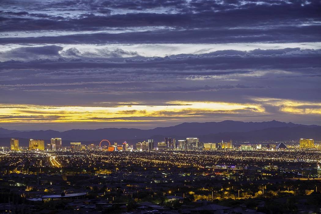 The view of the Las Vegas Strip and valley from the foothills of Summerlin underscore the commu ...