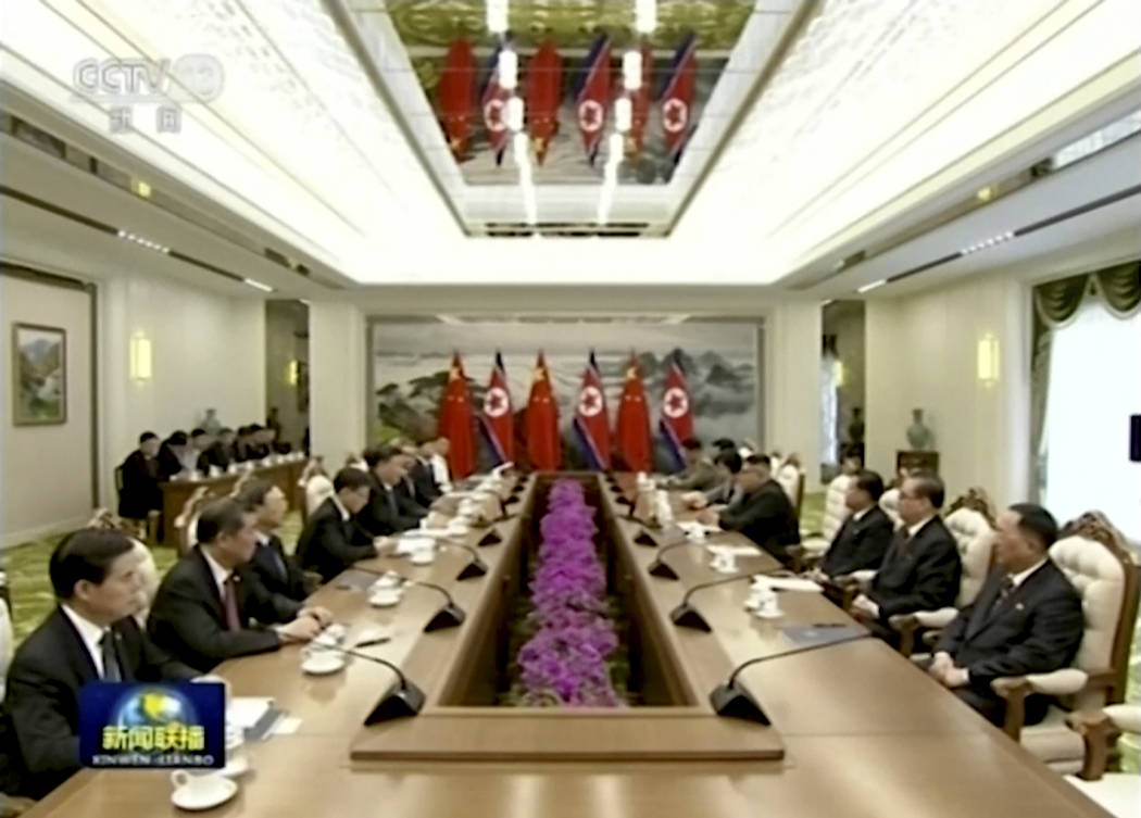 In this image taken from a video footage run by China's CCTV, Chinese President Xi Jinping and ...