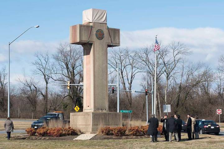 In a Feb. 13, 2019 file photo, visitors walk around the 40-foot Maryland Peace Cross dedicated ...