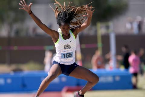 Ashley Moore of Centennial competes in the triple jump during the Class 4A state track meet at ...