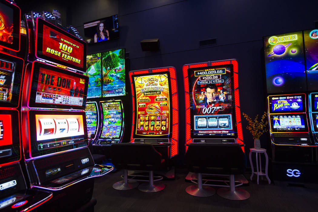 Slot cabinets with a curved 75" display and 4K resolution at the Scientific Games showroom ...