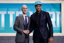 NBA Commissioner Adam Silver, left, poses for photographs with Kentucky's P.J. Washington, aft ...