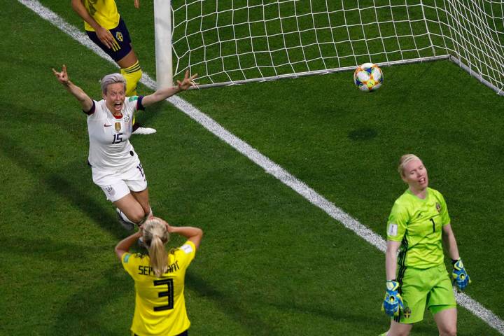 United States' Megan Rapinoe, left, celebrates after United States' Tobin Heath scored her side ...