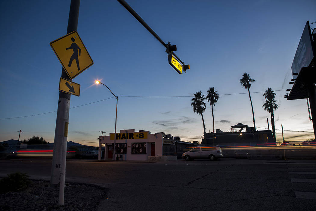 Cars drive by a crosswalk at the intersection of Whitney Avenue and Boulder Highway in Las Vega ...