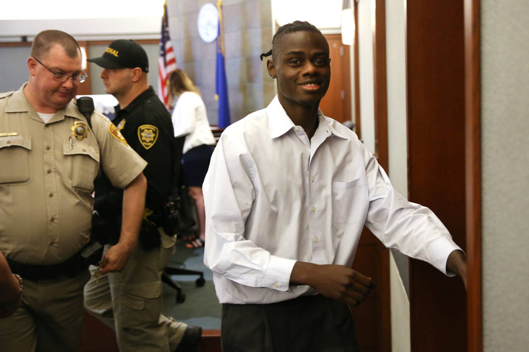 Weslie Martin is escorted out of a courtroom at the Regional Justice Center in Las Vegas on Fri ...