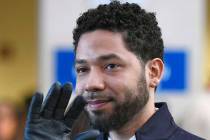 Actor Jussie Smollett smiles and waves to supporters before leaving Cook County Court after his ...