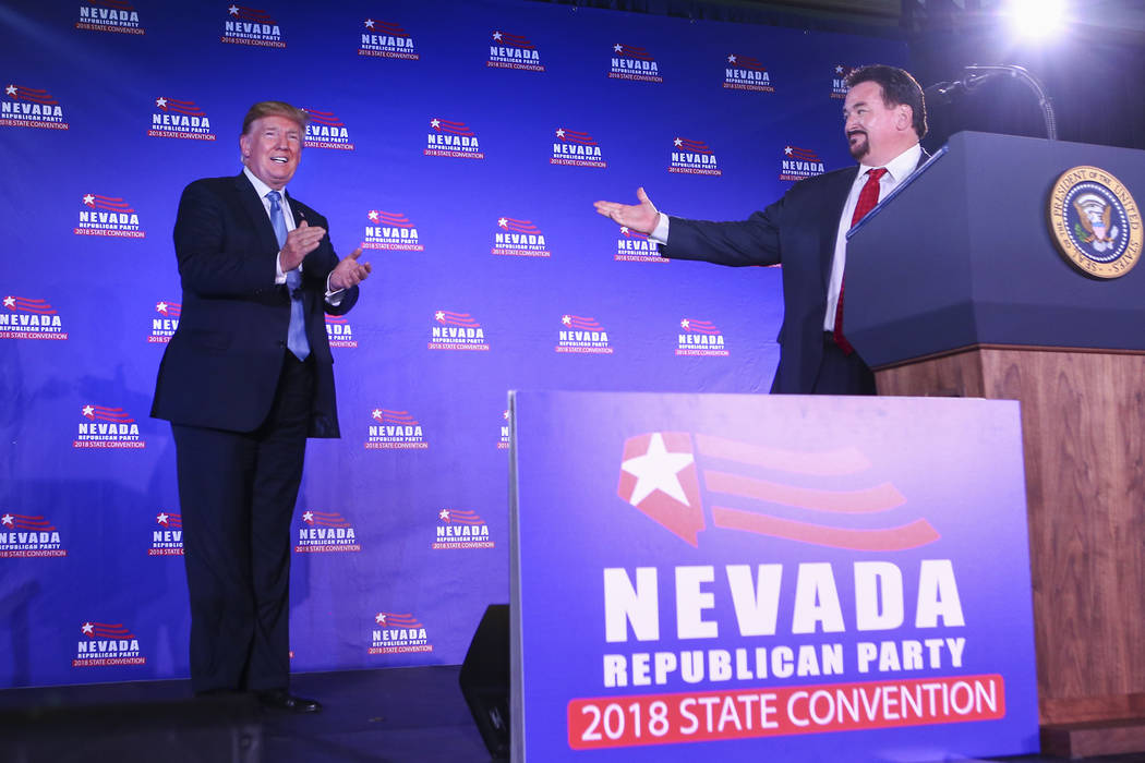 President Donald Trump is introduced by Nevada Republican Party Chairman Michael McDonald durin ...