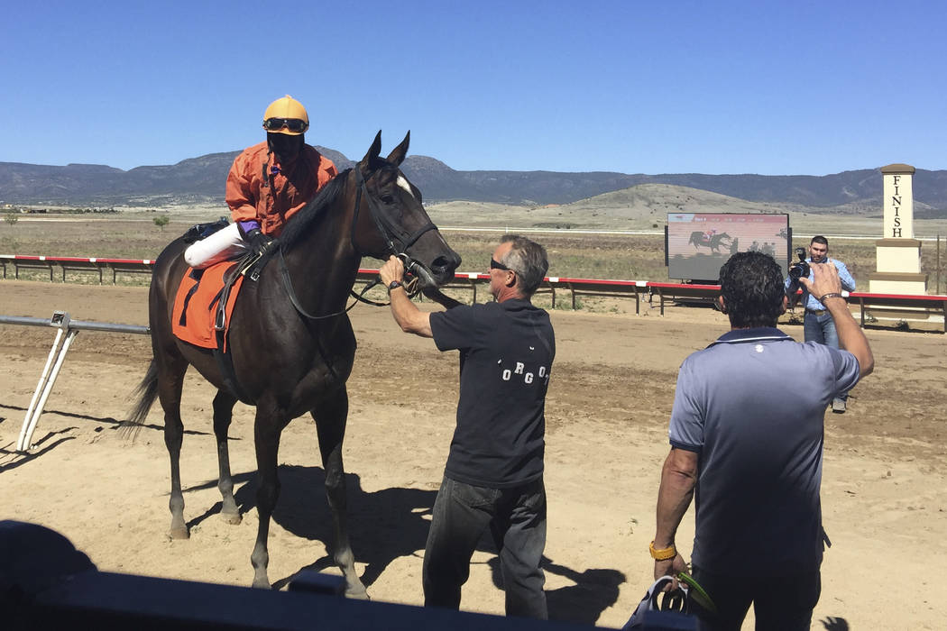 Carl Williams rides Sashaying Sis in the winner's enclosure at Arizona Downs in Prescott Valley ...