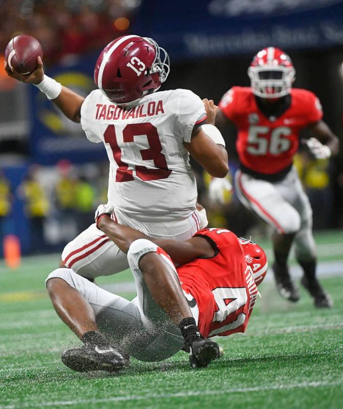 Georgia linebacker Channing Tindall (41) hits Alabama quarterback Tua Tagovailoa (13) during th ...