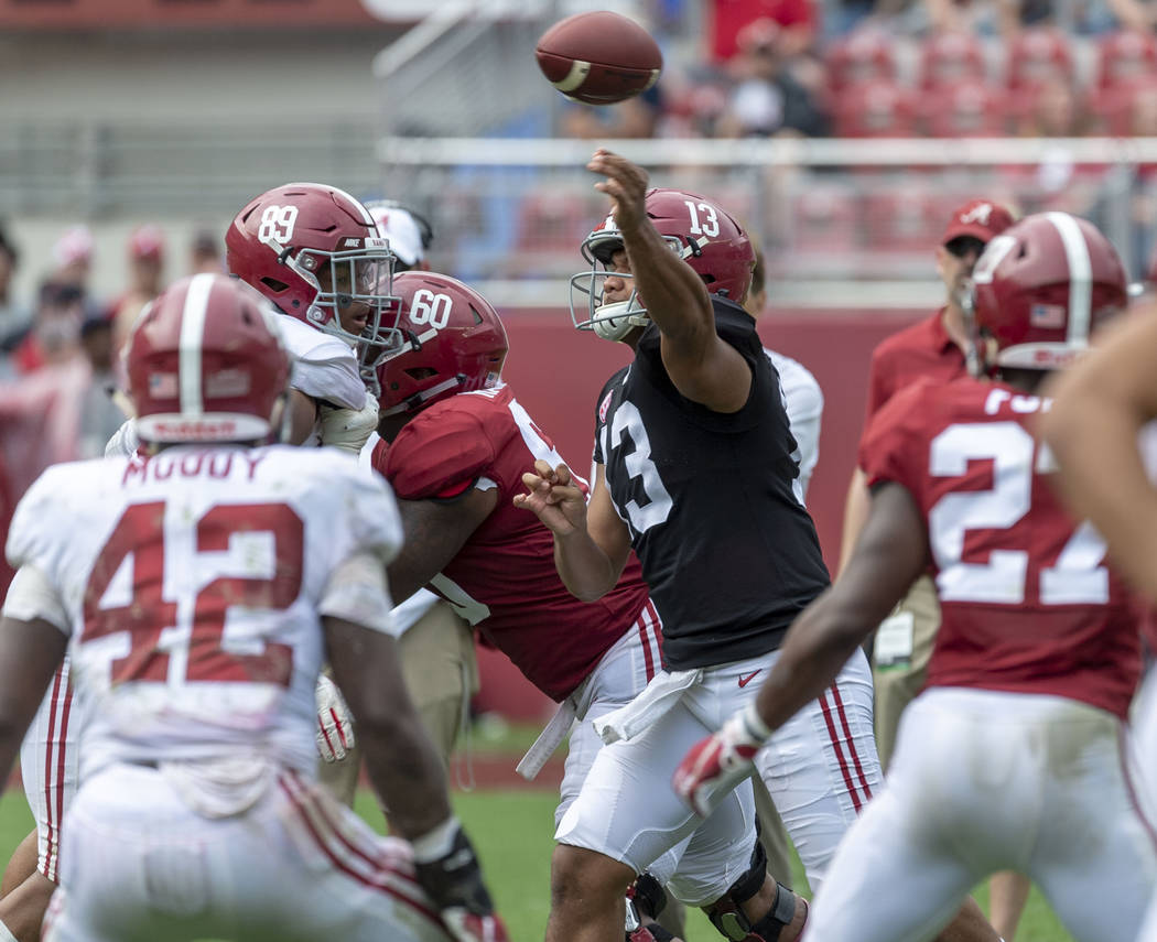 Alabama quarterback Tua Tagovailoa (13) throws in traffic during the second half of Alabama's A ...