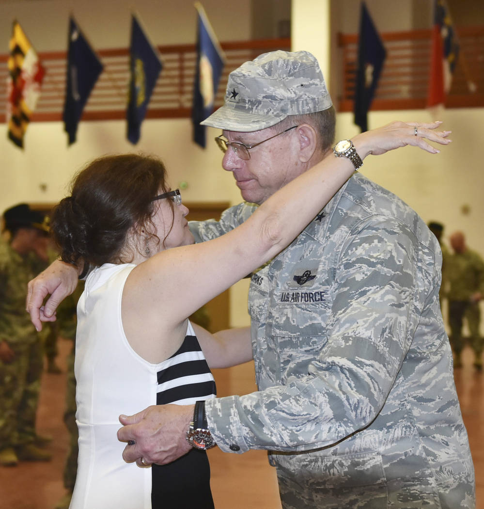 Margie Gallagher, left, receives a hug from Nevada Adjutant General Brig. Gen. Bill Burks follo ...
