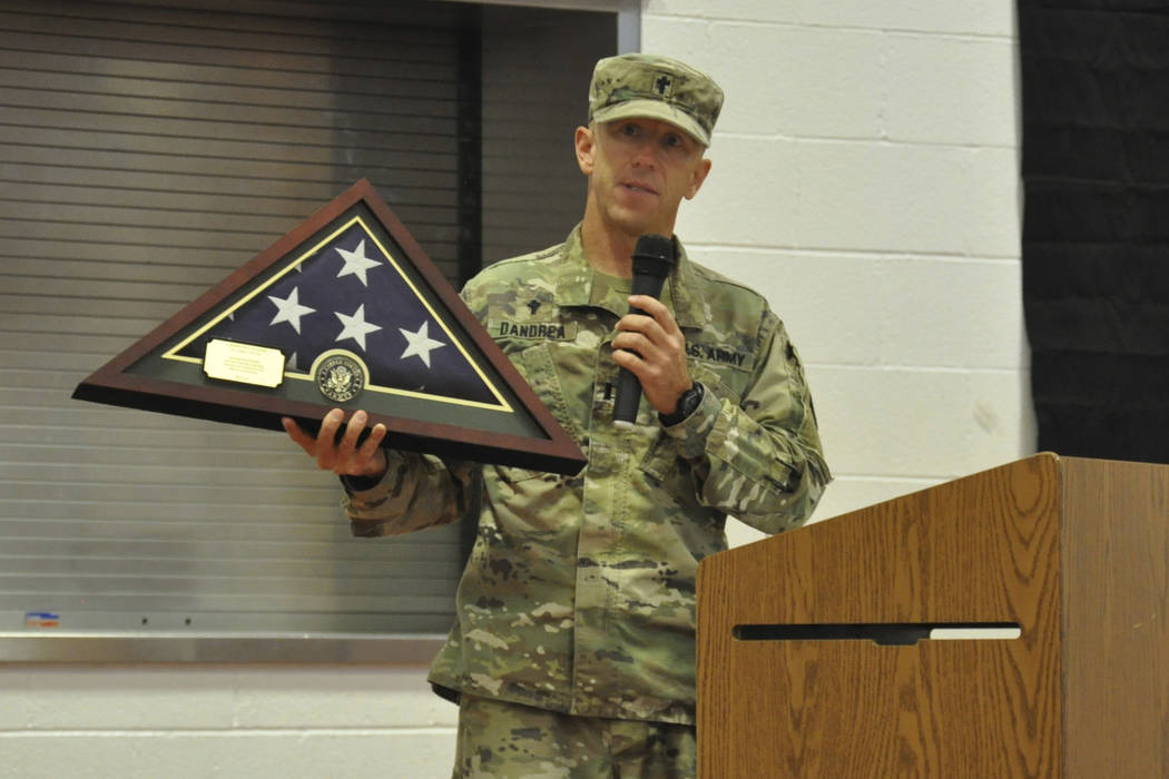 Nevada Army Guard chaplain Capt. Troy Dandrea holds the flag that will be permanently displayed ...