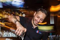 Bartender Eric Garcia makes drinks at Bastille on 3rd, the longest running LGBTQ bar in Las Veg ...
