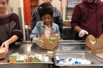 Jordyn Lenae, 11, helps pack lunches at Three Square. Jordyn said she believes every child shou ...