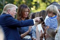 President Donald Trump and first lady Melania Trump greet attendees of the annual Congressional ...