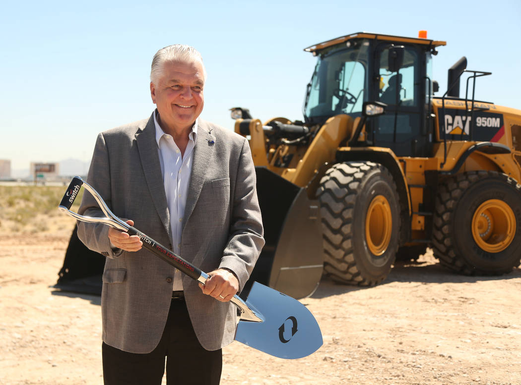 Nevada Governor Steve Sisolak poses after the shovel toss during the groundbreaking expansion c ...